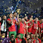 Current Morocco national team players alongside legendary figures from previous generations, illustrating the comparison between today's Atlas Lions and the great squads of the past.