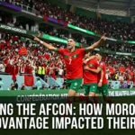 Morocco national team playing in front of a packed home crowd during the Africa Cup of Nations, with passionate supporters creating a powerful home-field atmosphere.