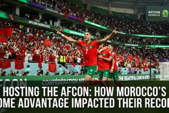 Morocco national team playing in front of a packed home crowd during the Africa Cup of Nations, with passionate supporters creating a powerful home-field atmosphere.