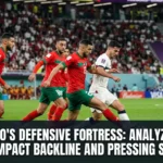 Morocco national team defenders maintaining a compact defensive shape while pressing opponents, showcasing the organization and discipline that define the Atlas Lions' defensive success.