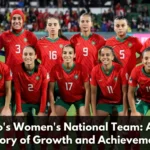 Morocco women's national football team players celebrating together on the pitch, representing the growth, achievements, and rising prominence of women's football in Morocco.