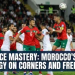Morocco national team players preparing for a corner kick and free-kick situation, demonstrating tactical organization, movement patterns, and aerial strength in set-piece play.