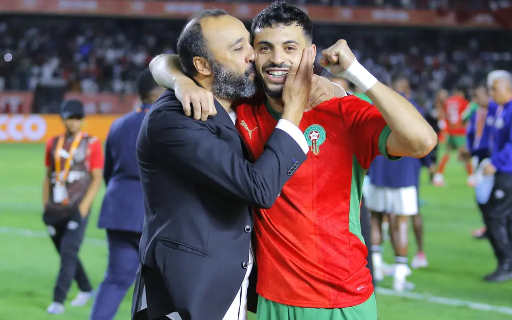 Morocco national team players executing a tactical formation during an international football match, showcasing the disciplined and dynamic playing style of the Atlas Lions.