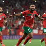 Morocco national team players with experience in European football leagues celebrating together, highlighting the influence of overseas-based talent on the Atlas Lions' success.