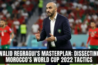Morocco head coach Walid Regragui directing players from the touchline during the 2022 FIFA World Cup, implementing the tactical system that guided the Atlas Lions to a historic tournament run.