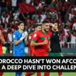 Morocco national team players competing in an Africa Cup of Nations match, symbolizing the challenges, near misses, and competitive obstacles faced since the 1976 AFCON triumph.