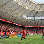 Jonathan David celebrates after scoring for Canada in the 6-0 win over Qatar at BC Place in Vancouver.