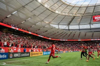 Jonathan David celebrates after scoring for Canada in the 6-0 win over Qatar at BC Place in Vancouver.