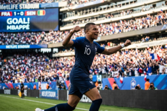 Alt Text Kylian Mbappe celebrates during France’s 3-1 World Cup win over Senegal at MetLife Stadium.