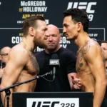 Conor McGregor vs Max Holloway UFC 329 fight poster with date and Las Vegas venue details.