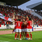 Morocco's women's national team players celebrate during their WAFCON 2026 Group A match against Senegal at a packed stadium in Rabat.