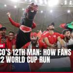 Excited Moroccan football fans with flags and mascot at World Cup.