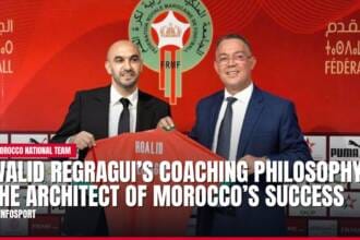 Moroccan football coach Walid Regragui holding jersey with official.