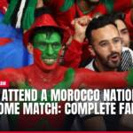 Cheering Moroccan football fans, one in red and green face paint.