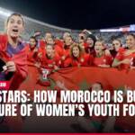 Moroccan women's football team celebrates with national flag.