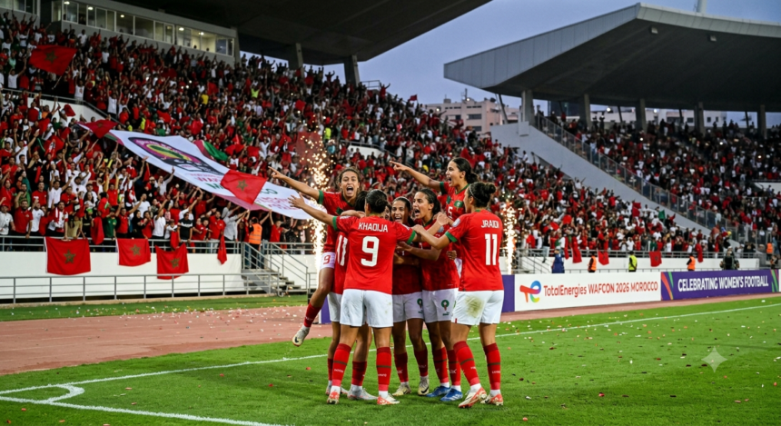 Morocco's women's national team players celebrate during their WAFCON 2026 Group A match against Senegal at a packed stadium in Rabat.
